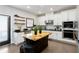 Modern kitchen with stainless steel appliances, white cabinets, and a stylish island at 371 Northaven Ave, Suwanee, GA 30024