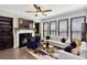 Inviting living room features a fireplace, contemporary decor, and ample natural light for a cozy atmosphere at 371 Northaven Ave, Suwanee, GA 30024
