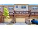 Rear exterior view of brick townhomes with private decks and garage parking at 371 Northaven Ave, Suwanee, GA 30024