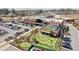 An aerial view displays the community building with an outdoor mini-golf course and parking at 427 Burton Dr, Alpharetta, GA 30009