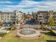 Town center view with multi-story apartments, storefronts, and town hall at 427 Burton Dr, Alpharetta, GA 30009
