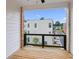 Outdoor balcony overlooking the surrounding community with wood decking and a dark metal railing at 427 Burton Dr, Alpharetta, GA 30009