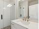 Modern bathroom featuring a glass-enclosed shower, white vanity, and stylish fixtures at 427 Burton Dr, Alpharetta, GA 30009