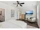 Relaxing bedroom features an accent chair, ceiling fan, and wall-mounted TV at 427 Burton Dr, Alpharetta, GA 30009