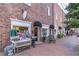Quaint storefront with brick facade, displays charming decorations and an inviting entrance at 427 Burton Dr, Alpharetta, GA 30009