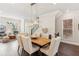 Elegant dining area with a wooden table, upholstered chairs, and modern chandelier at 427 Burton Dr, Alpharetta, GA 30009