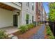 Townhome exterior with patio, privacy fence, and manicured gravel path at 427 Burton Dr, Alpharetta, GA 30009
