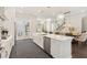 Bright kitchen featuring a large island, quartz countertops, stainless steel appliances, and elegant pendant lighting at 427 Burton Dr, Alpharetta, GA 30009