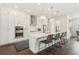 Modern kitchen with white cabinets, stainless steel appliances, and a quartz island at 427 Burton Dr, Alpharetta, GA 30009