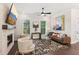 Inviting living room with a stone fireplace, decorative art, and stylish furnishings at 427 Burton Dr, Alpharetta, GA 30009