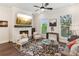 Cozy living room featuring a stone fireplace, TV, neutral furniture, and a stylish rug at 427 Burton Dr, Alpharetta, GA 30009