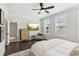 Serene main bedroom with hardwood floors, natural light, and a walk-in closet at 427 Burton Dr, Alpharetta, GA 30009