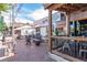 A beautifully paved outdoor seating area with tables, chairs, and umbrellas provides a comfortable dining experience at 427 Burton Dr, Alpharetta, GA 30009