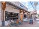 An inviting restaurant exterior boasts a brick facade, large windows, and a cozy outdoor seating area at 427 Burton Dr, Alpharetta, GA 30009