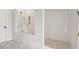 Walk-in shower featuring white tiled walls, river rock flooring, and a glass enclosure at 427 Burton Dr, Alpharetta, GA 30009