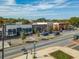 A street view displays a row of commercial buildings with diverse architecture at 427 Burton Dr, Alpharetta, GA 30009