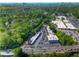 Stunning aerial view showcasing a bustling commercial area surrounded by lush greenery and a distant cityscape at 470 Ansley Walk Ne Ter, Atlanta, GA 30309