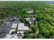 Expansive aerial shot of a neighborhood with a mix of commercial buildings, dense trees, and visible parking areas at 470 Ansley Walk Ne Ter, Atlanta, GA 30309