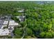 Wide aerial shot displaying commercial spaces bordered by thick forests and a visible parking lot at 470 Ansley Walk Ne Ter, Atlanta, GA 30309