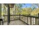 Private tiled balcony with sliding glass doors offers serene views of the surrounding lush greenery at 470 Ansley Walk Ne Ter, Atlanta, GA 30309