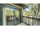 Charming balcony with sliding door access showcasing scenic treetop views and natural light at 470 Ansley Walk Ne Ter, Atlanta, GA 30309