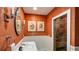 Chic bathroom with sink, shower with a glass door, and copper colored walls at 470 Ansley Walk Ne Ter, Atlanta, GA 30309