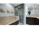 Bathroom with a tub, a glass shower, and a modern vanity with stylish lighting at 470 Ansley Walk Ne Ter, Atlanta, GA 30309