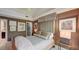 Spacious bedroom featuring neutral tones, a ceiling fan, and elegant decor, creating a serene and inviting space at 470 Ansley Walk Ne Ter, Atlanta, GA 30309