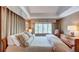 Well-appointed bedroom showcasing a large bed, plush pillows, and natural light, offering a comfortable and stylish retreat at 470 Ansley Walk Ne Ter, Atlanta, GA 30309