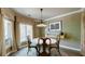 Well-appointed dining room with a round table, elegant decor, and abundant natural light at 470 Ansley Walk Ne Ter, Atlanta, GA 30309