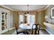 Dining Room with seating for four people, neutral paint and crown molding at 470 Ansley Walk Ne Ter, Atlanta, GA 30309