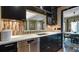 Charming kitchen with stainless steel dishwasher, breakfast bar, and adjoining dining area at 470 Ansley Walk Ne Ter, Atlanta, GA 30309