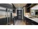 Galley kitchen featuring dark cabinets, stainless steel appliances, and light countertop at 470 Ansley Walk Ne Ter, Atlanta, GA 30309