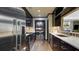 Galley kitchen featuring dark cabinets, stainless steel appliances, and light countertop at 470 Ansley Walk Ne Ter, Atlanta, GA 30309