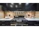 Gourmet kitchen showcasing a stainless steel range and sleek black cabinetry at 470 Ansley Walk Ne Ter, Atlanta, GA 30309