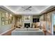 Inviting living room featuring a fireplace, hardwood floors, and French doors to outdoor space at 470 Ansley Walk Ne Ter, Atlanta, GA 30309