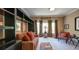 Bright living room featuring a daybed, bookshelves, and natural light at 470 Ansley Walk Ne Ter, Atlanta, GA 30309