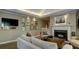 Open concept living room with fireplace, sofa and hardwood flooring at 470 Ansley Walk Ne Ter, Atlanta, GA 30309