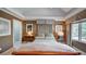 Serene bedroom featuring tray ceilings, soft lighting, and picturesque window views at 470 Ansley Walk Ne Ter, Atlanta, GA 30309