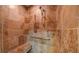 Luxurious tiled shower with a built-in bench and modern fixtures at 470 Ansley Walk Ne Ter, Atlanta, GA 30309