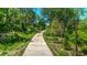 Tranquil walking trail lined with mature trees, offering a peaceful and refreshing outdoor experience at 470 Ansley Walk Ne Ter, Atlanta, GA 30309