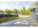 Large backyard with a wood fence and concrete patio, perfect for outdoor activities and entertaining at 635 Hickory Nobb, Sugar Hill, GA 30518