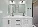 Modern bathroom vanity with double sinks, quartz countertop, and stylish fixtures at 635 Hickory Nobb, Sugar Hill, GA 30518