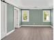 Well-lit main bedroom features a sliding barn door to the bathroom at 635 Hickory Nobb, Sugar Hill, GA 30518
