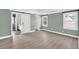 Well-lit main bedroom features a sliding barn door to the bathroom at 635 Hickory Nobb, Sugar Hill, GA 30518