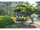 Bent Creek community sign surrounded by mature landscaping, creating a welcoming entrance at 635 Hickory Nobb, Sugar Hill, GA 30518
