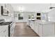 Bright and airy kitchen featuring an island, stainless steel appliances, and plenty of counter space at 635 Hickory Nobb, Sugar Hill, GA 30518