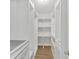 Bright walk-in closet with adjustable shelving and drawers, perfect for organization at 635 Hickory Nobb, Sugar Hill, GA 30518