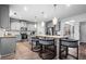 Modern kitchen featuring stainless steel appliances, granite countertops, and a large island with seating at 7554 Crawford Ct, Fairburn, GA 30213