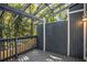 A wood porch with a dark wood privacy fence and a lattice overhead at 1022 Mariners Ct, Stone Mountain, GA 30083